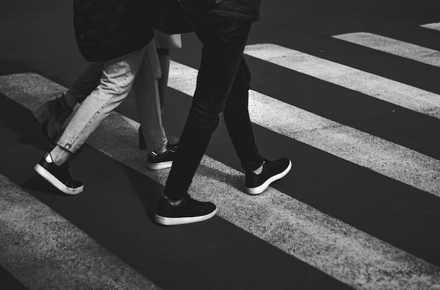 people walking in a crosswalk